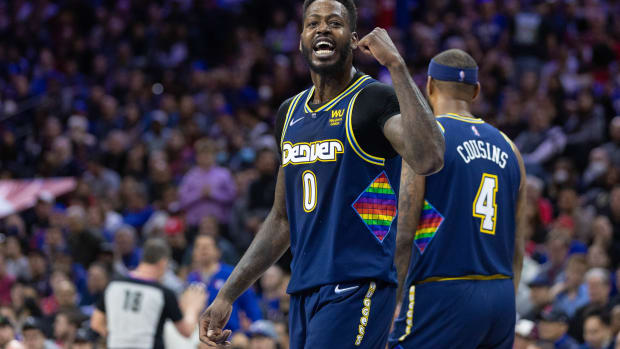 Mar 14, 2022; Philadelphia, Pennsylvania, USA; Denver Nuggets forward JaMychal Green (0) reacts to a fan during the fourth quarter against the Philadelphia 76ers at Wells Fargo Center. Mandatory Credit: Bill Streicher-USA TODAY Sports